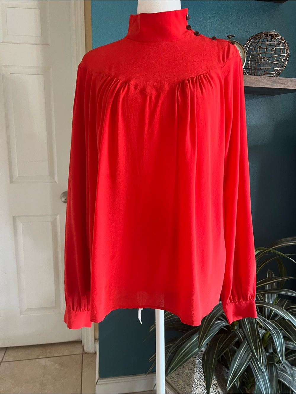 Closed Red High-Neck Blouse with Shoulder Buttons